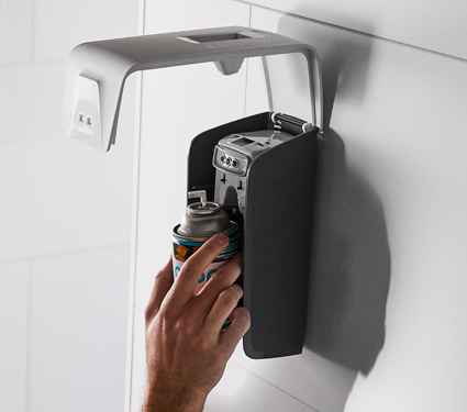 A group of images showing the Essential Series air freshener dispensers by UniFirst
