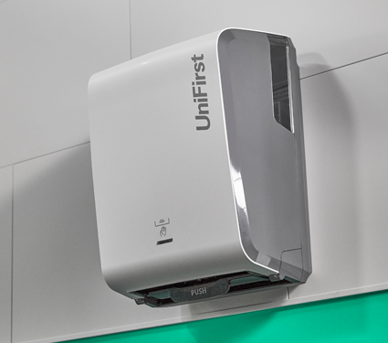 A collection of images featuring the Essential Series paper dispensers by UniFirst